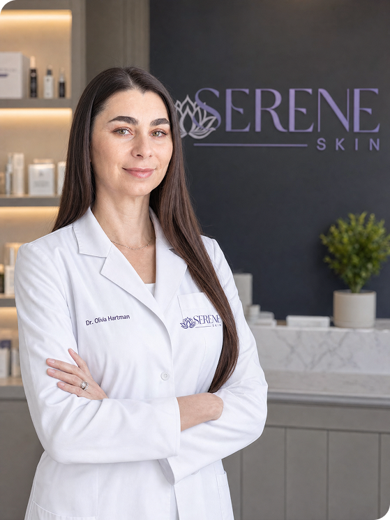 Dr. Olivia Hartman standing in a modern skincare clinic